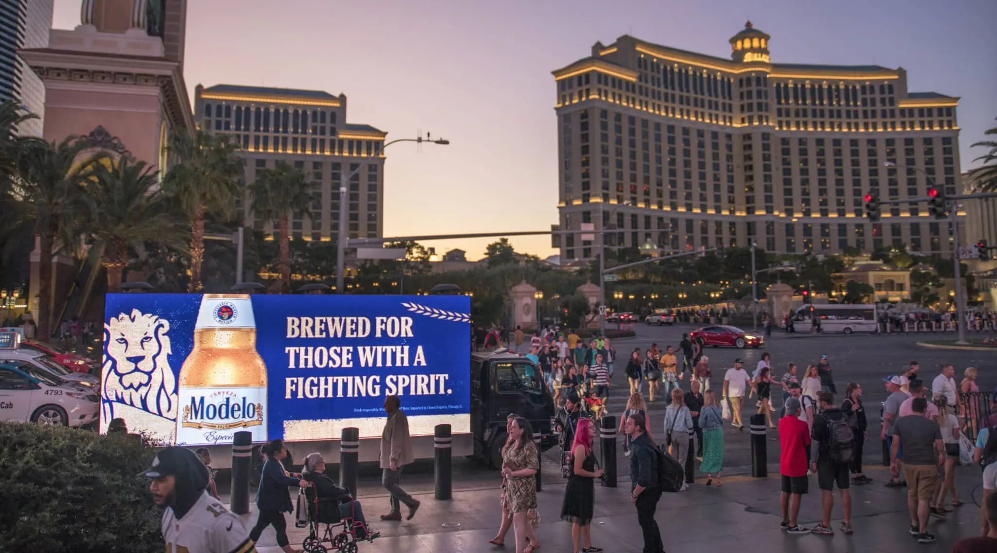 Las Vegas mobile billboard trucks on the Strip with people looking.